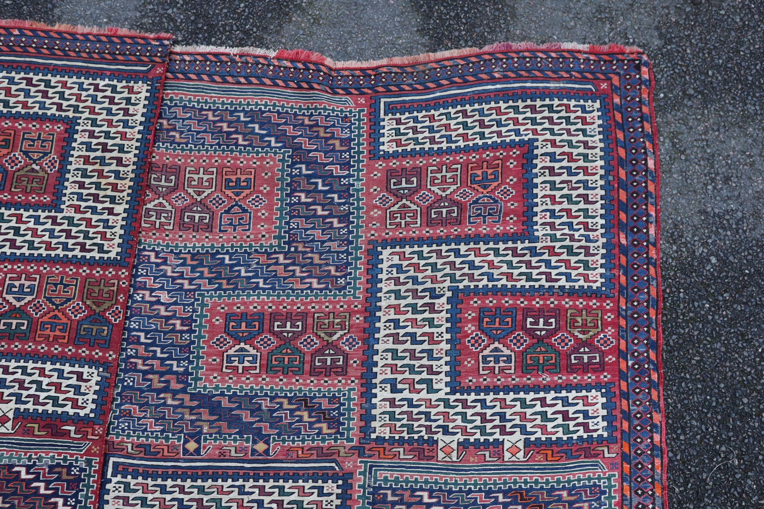 A Sumak weave 2-sectional carpet, combined dimension - 320 x 230cm.